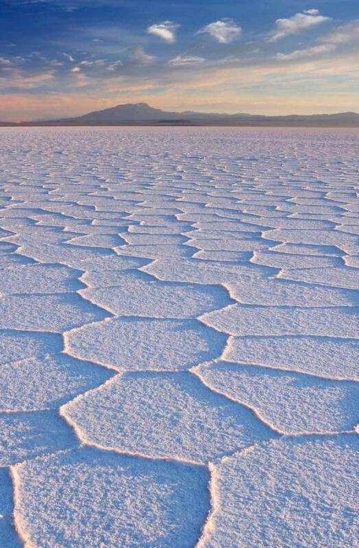 Salt flat Salar de Uyuni in Bolivia at sunrise