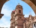 A church in the city of Cusco, Peru, seen through an archway