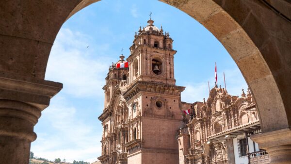 A church in the city of Cusco, Peru, seen through an archway