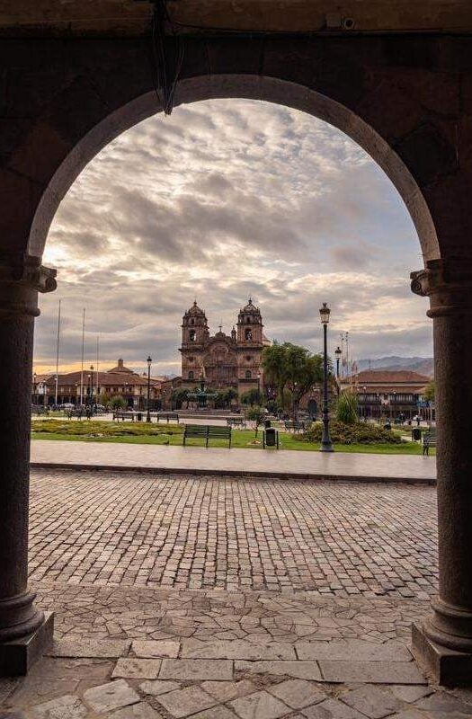 Cusco Cathedral seen through the arches in the main plaza