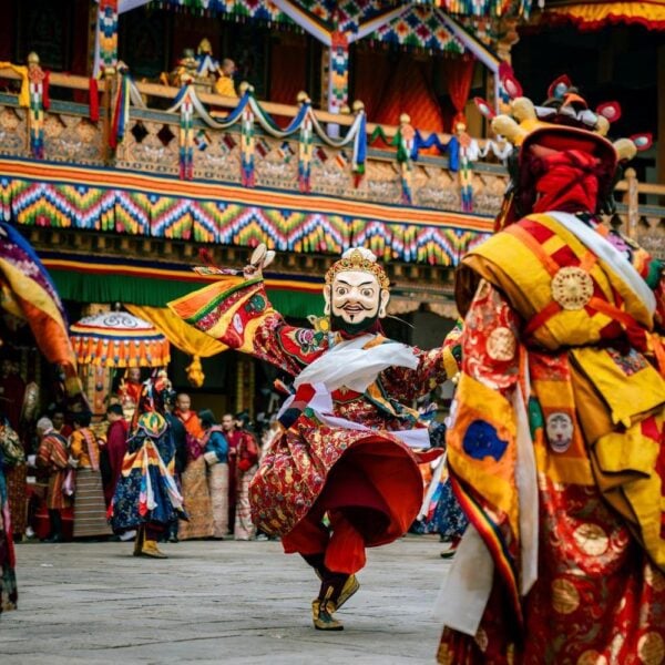 Punakha Tshechu in Bhutan masked dancer in traditional clothing