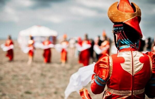 Photo of young beautiful women wearing in traditional national mongolian kalmykian dresses in the festival Photo of young beautiful women wearing in traditional national mongolian kalmykian dresses in the festival. yurt, nomad, mongolian, woman, culture, accessories, asia, beads, century, city, clothing, colorful, copy, costume, dance, decoration, detailed, dress, empire, ethnic, fashion, female, festival, folklore, genghis, girl, hat, khan, kalmykia, mongol, mongolia, national, native, outfit, people, space, style, symbol, symbolic, temple, traditional, unique, white, young, red, clouds, field, spring, early Mongolia