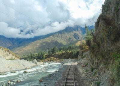 The Vistadome train tracks running alongside the Urubamba river in Peru