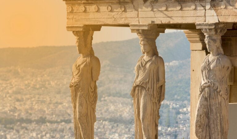 the karyatides statues at sunset in Athens, Greece