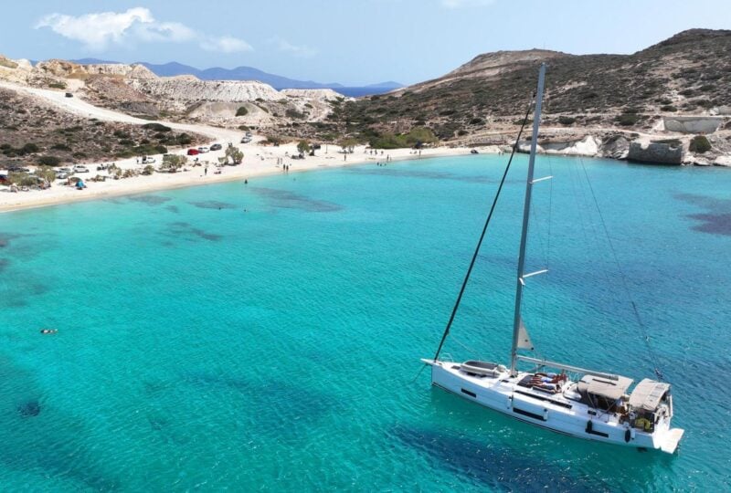 A yacht floating in the sea off Prassa beach in Kimolos, Greece