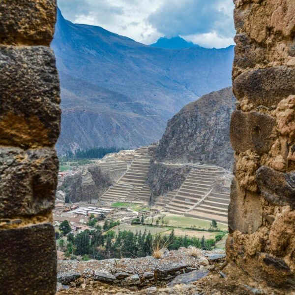 A view through a window of Inca ruins in the Sacred Valley, Peru